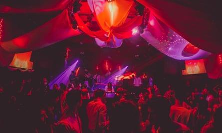Crowds dance under the lights at club Sugarfactory, Amsterdam, the Netherlands.