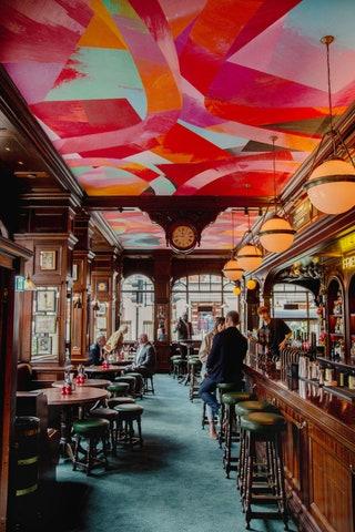 Naturally plenty of artwork is dotted around the room. Immediately contrasting with the traditional aesthetic is the...